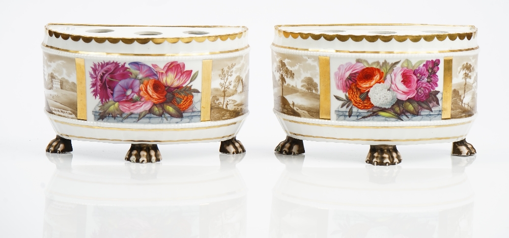 A pair of Ridgway porcelain demi-lune bulb pots, circa 1810-15, each raised on three paw feet,