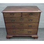 A mid-18th century mahogany chest with two short and three long graduated drawers on ogee bracket