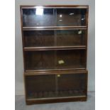 A 20th century four section walnut Minty modular bookcase, 86cm wide.