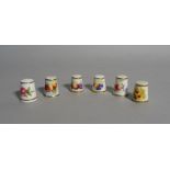 A group of six Royal Worcester thimbles, black printed marks, painted with flowers or fruit,