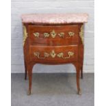 A Louis XV style gilt metal mounted marble top commode with bombe two drawer base on cabriole