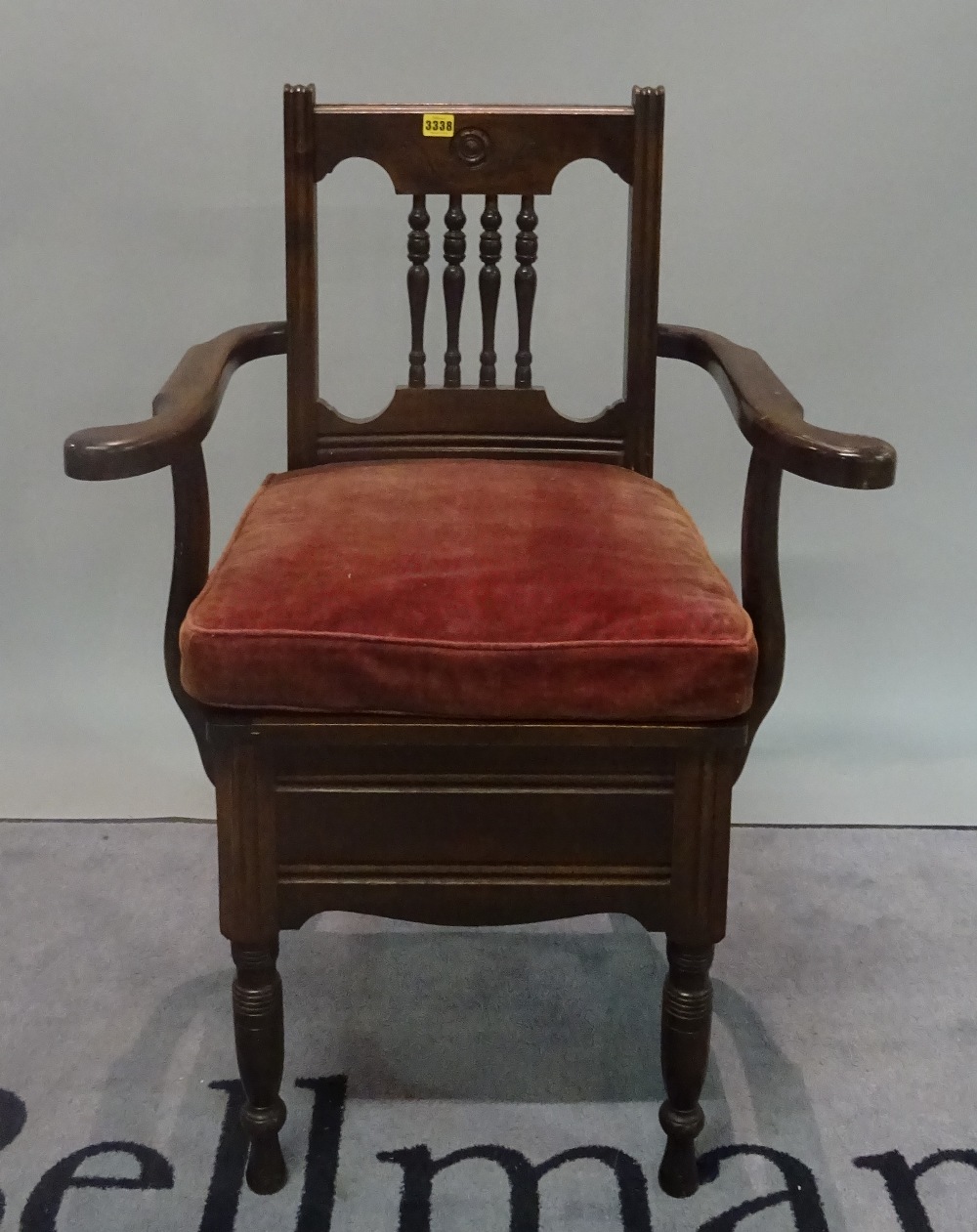 A Victorian mahogany framed open armchair commode on ring turned supports, 65cm wide x 97cm high.