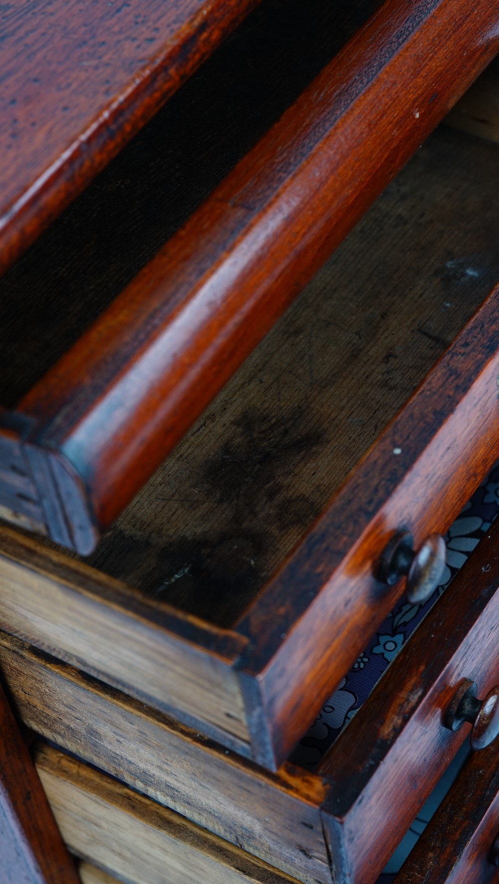 A miniature mahogany chest with a cushion drawer over four long graduated drawers on bun feet, - Image 5 of 5