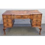 A figured walnut bowfront writing desk of George II style,