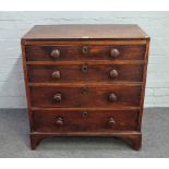A small George III mahogany chest with four long graduated drawers on bracket feet,