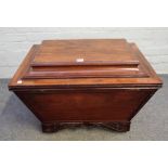 A late Regency mahogany sarcophagus shaped cellarette on carved bracket feet, 72cm wide x 52cm high.