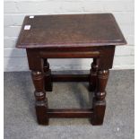 A 17th century and later oak joint stool on baluster supports united by perimeter stretcher,