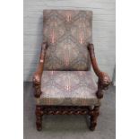 A mahogany framed square back open armchair with beast head arm finials on barley twist supports,