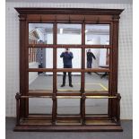 A large Victorian mahogany and brass mirrored back hall stand with triple division stick stand,