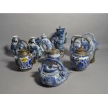 Asian ceramics including a pair of modern white metal mounted blue and white tea pots,