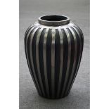 A modern polished steel ribbed baluster vase, 61cm high.