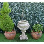 A pair of Compton style terracotta scroll garden pots, 44cm wide x 32cm high,