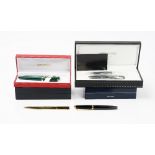 A Caran d'ache black laque de chine fountain pen, with booklet and refill, a Bvlgari ballpoint pen,