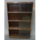 A 20th century four section walnut Minty modular bookcase, 81cm wide.