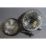 NOTEK, an early 20th century car headlight, 23cm wide, and another smaller by HELLA, 15cm wide, (2).