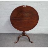 A mid-18th century mahogany circular snaptop occasional table on spiral fluted column on a tripod