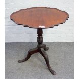 An 18th century Irish mahogany snap top piecrust occasional table on a tripod base,