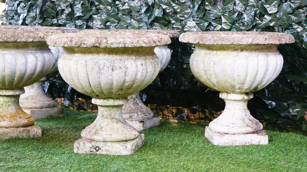 A set of five reconstituted stone circular jardinieres with semi-fluted bodies on turned socles, - Image 2 of 3