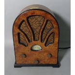 A mid-20th century burr walnut radio, 22cm wide x 28cm high.