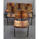 A set of six modern black painted tubular framed dining chairs with leopard and tiger print