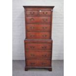 A George III style small mahogany chest on chest with two short over six long graduated drawers,