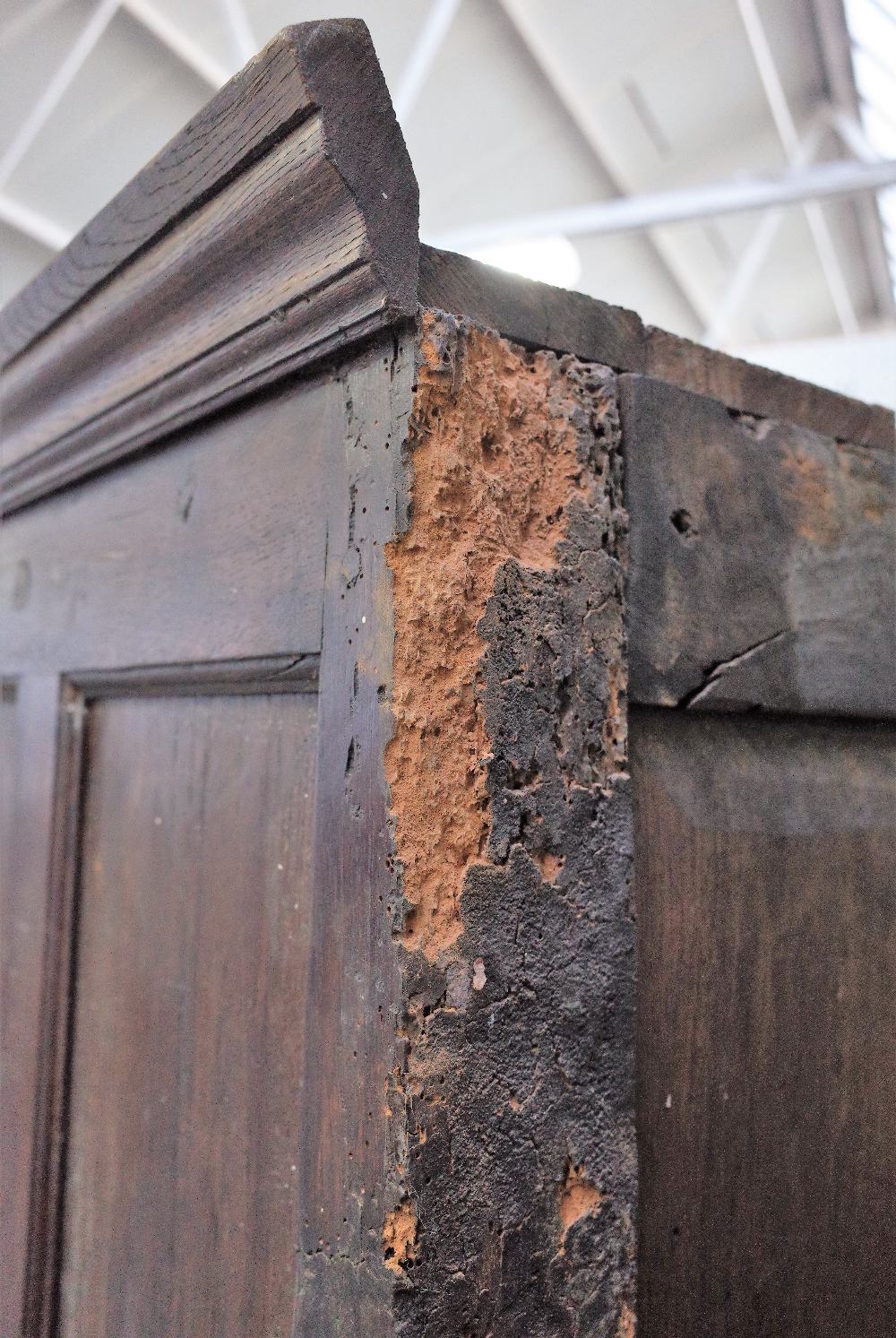 A 17th century style oak hanging cupboard, of panelled construction, incorporating earlier elements, - Image 6 of 6