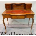 A late 19th century walnut writing desk with covered super structure over frieze drawer on cabriole