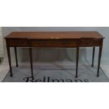 A George III style mahogany breakfront sideboard with three frieze drawers on tapering square