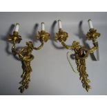 A pair of Victorian style gilt metal two branch wall lights, 31cm wide x 48cm high, (2).
