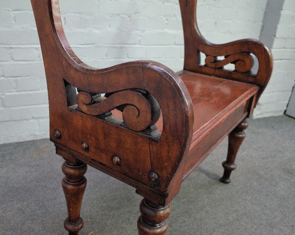 A Victorian Arts and Crafts stained oak box seat hall bench with turned back rail and supports, - Image 2 of 3