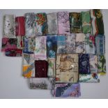 A collection of mainly souvenir silk scarves and handkerchiefs and a collection of graphic drawn