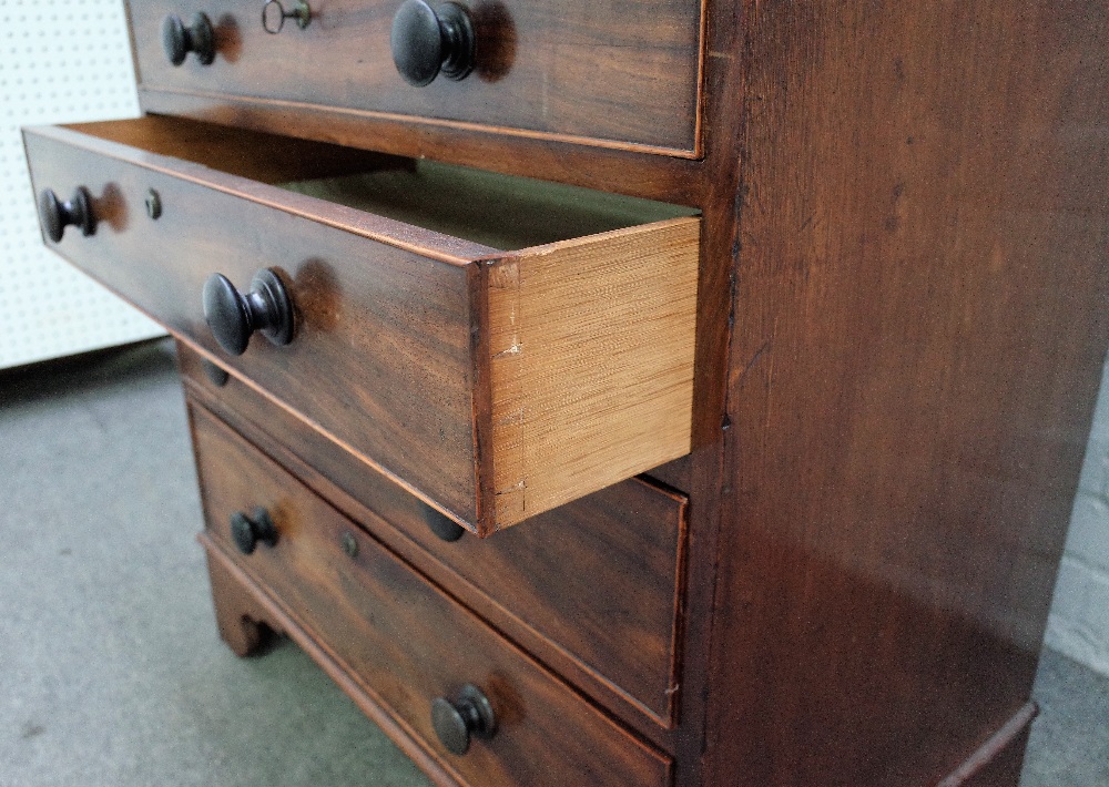 A George III small mahogany chest with four long graduated drawers on bracket feet, - Image 4 of 4