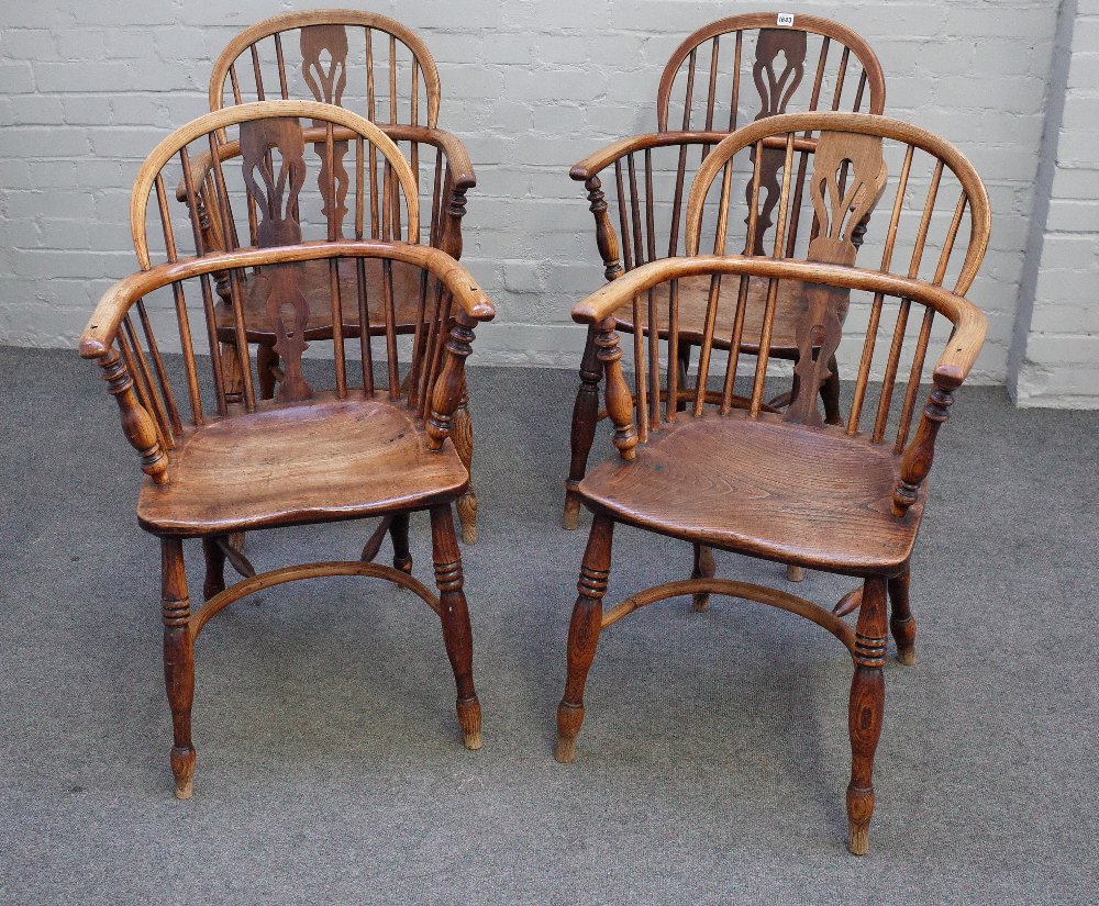 A set of three ash and elm Windsor elbow chairs, 19th century, with pierced splats,