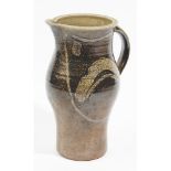 Michael Casson ( 1925-2003), a saltglazed stoneware jug, of pear form with loop handle,