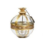 A modern lacquered brass globe lantern with an internal four light pendant, fitted for electricity,