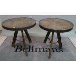A pair of modern hardwood and metal circular occasional tables, 75cm wide x 73cm high, (2).