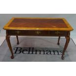 A Victorian style simulated elm three drawer writing desk on pad feet, 122cm wide x 76cm high.