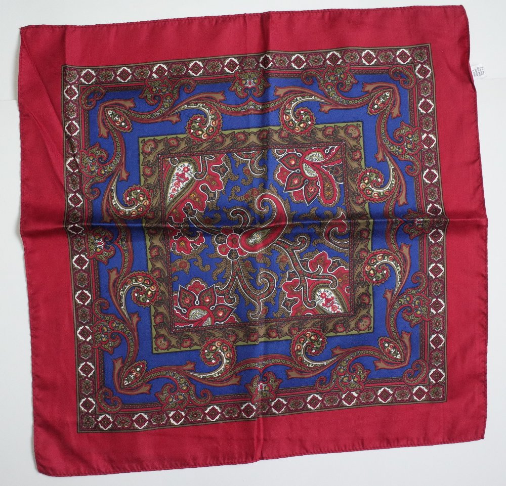 A large collection of twenty-five silk and wool scarves each printed with a paisley design, - Image 25 of 28