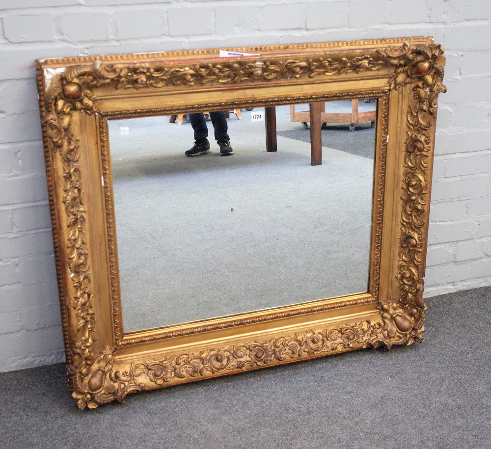 A 19th century rectangular gilt frame with moulded scroll chased decoration and later mirror plate,