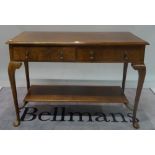 An 18th century style walnut two drawer side table on cabriole supports,