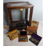 An early 20th century mahogany Chemist's scales, cased, a group of five cased weights (6).