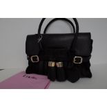 A Luella black leather and pony skin handbag with gold-tone hardware,