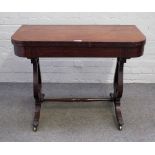 A Regency inlaid mahogany D-shaped tea table on lyre supports united by a turned stretcher,