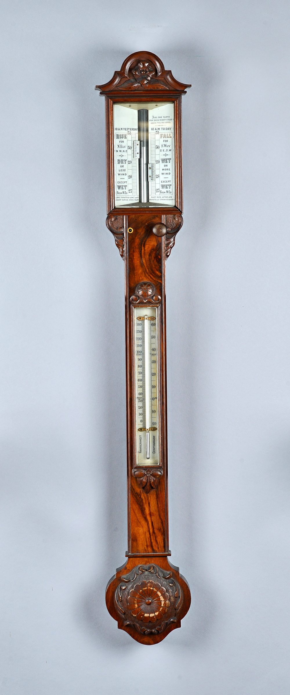 A Victorian walnut barometer With porcelain scales and twin verniers 101cm high