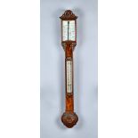 A Victorian walnut barometer With porcelain scales and twin verniers 101cm high