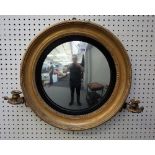 A 19th century gilt framed girandole convex wall mirror with ebonised slip and pair of candle