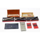 Three Celine, Paris, ballpoint pens, each boxed, a Laguiole fountain and ballpoint pen set, boxed,