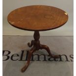 A George III and later mahogany tripod table with turned column on three downswept supports,