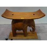 A mid-20th century hardwood Ashanti style stool, with elephant support, 55cm wide x 46cm high.