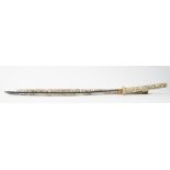 A Japanese carved bone long sword Meiji period, the hilt and scabbard carved in relief with figures,